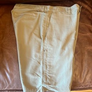 REI Men’s Khaki nylon lightweight shorts with side pockets and zipper pockets.